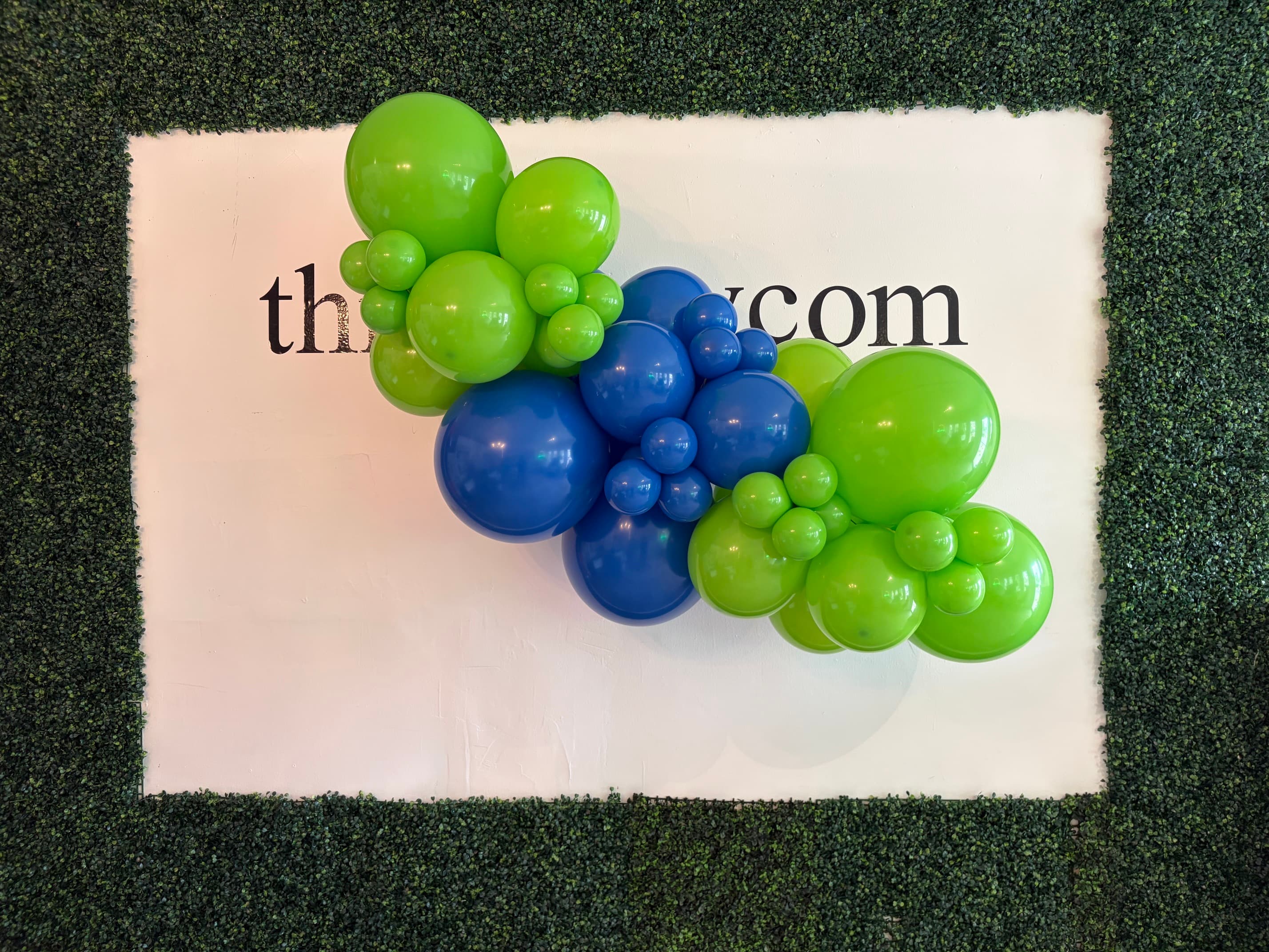 Completed 16-foot blue and green organic balloon garland by Rosy